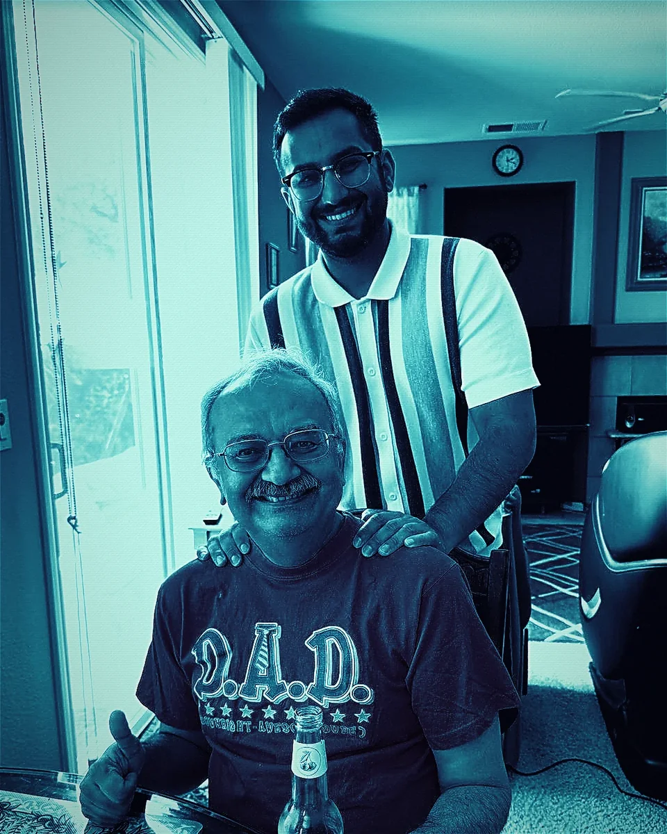 The father-and-son founders of Maneev Associates, in a cyan-tinted, scan-lined portrait